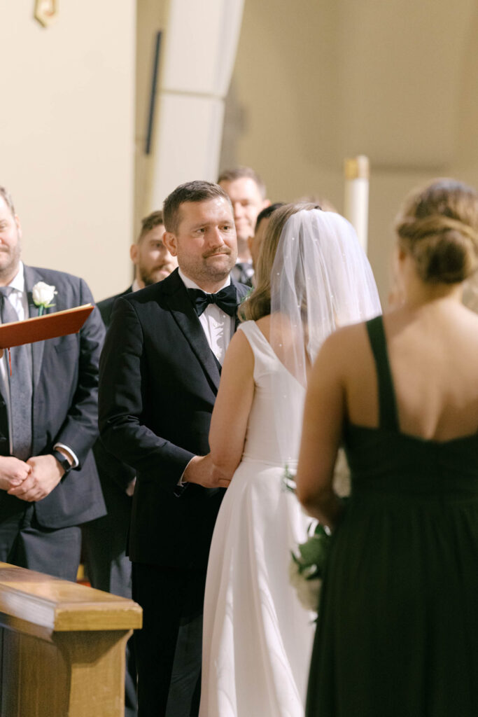 Bride and groom exchanging vows during a Kansas City church wedding ceremony