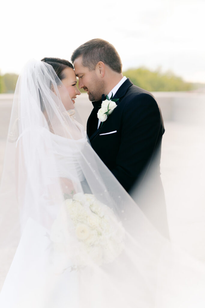 Bride and groom sharing a quiet moment together during sunset wedding portraits