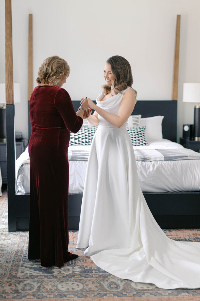 Mother helping the bride get ready in the bridal suite at Crossroads Hotel Kansas City