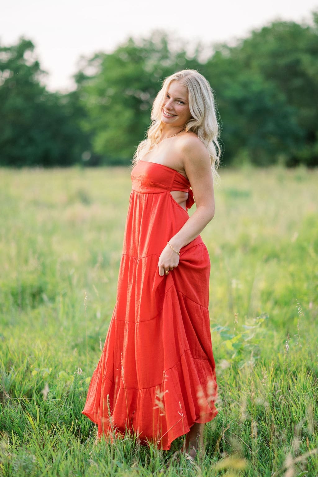 Dreamy senior photos of Berkley at Shawnee Mission Park with green fields