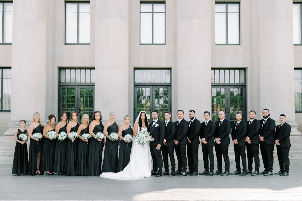 bride and groom with bridal party at the nelson atkins in kansas city