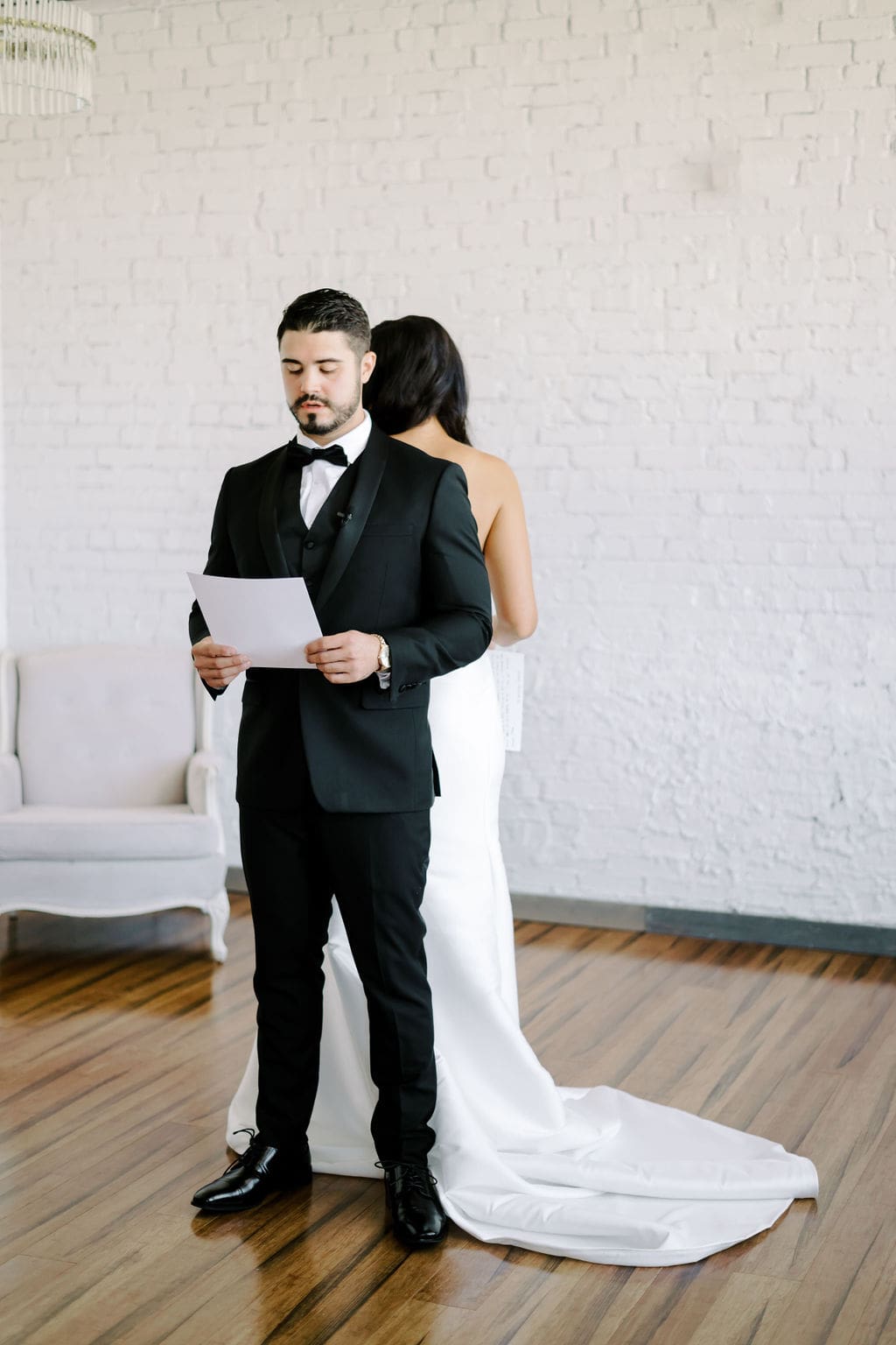 bride and groom during first look and private vow reading moment